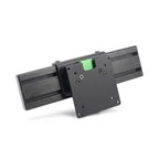 Black VESA monitor mounting plate attached to a section of black aluminum extrusion profile, viewed from the front on a white background.