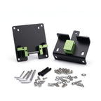 Disassembled VESA monitor mount bracket with black plates and green components, accompanied by a hardware kit including various screws, washers, and Allen wrenches on a white background.